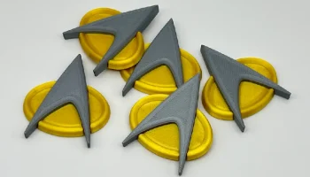 Значок Star Trek Com с магнитным креплением.........
