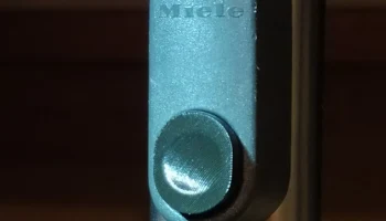 Кнопка блокировки вакуумной трубки Miele