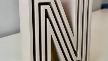 Начальная буква "N" декоративного блока 1