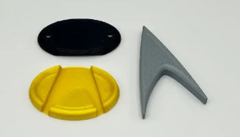 Значок Star Trek Com с магнитным креплением......... 1