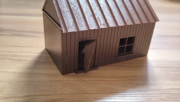 Модель небольшой деревянной хижины Модель небольшой деревянной хижины