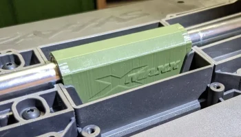 X-Maxx Basher Block (опорный блок центрального приводног...
