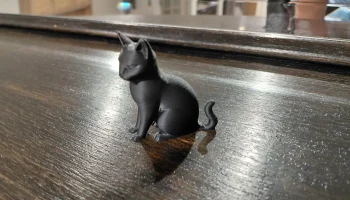 Современная фигурка черного кота......