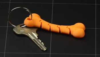 Гибкий брелок из кости 4
