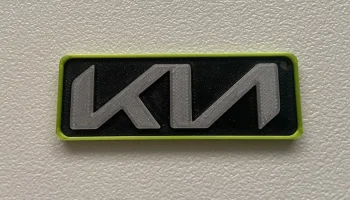 Брелок с логотипом KIA из одного и нескольких материалов....